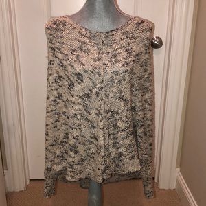 Sweater poncho with sleeves